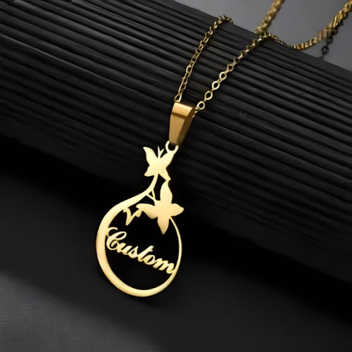 GOLD PERSONALIZED  NAME PENDANT DECORATED WITH BUTTERFLY.