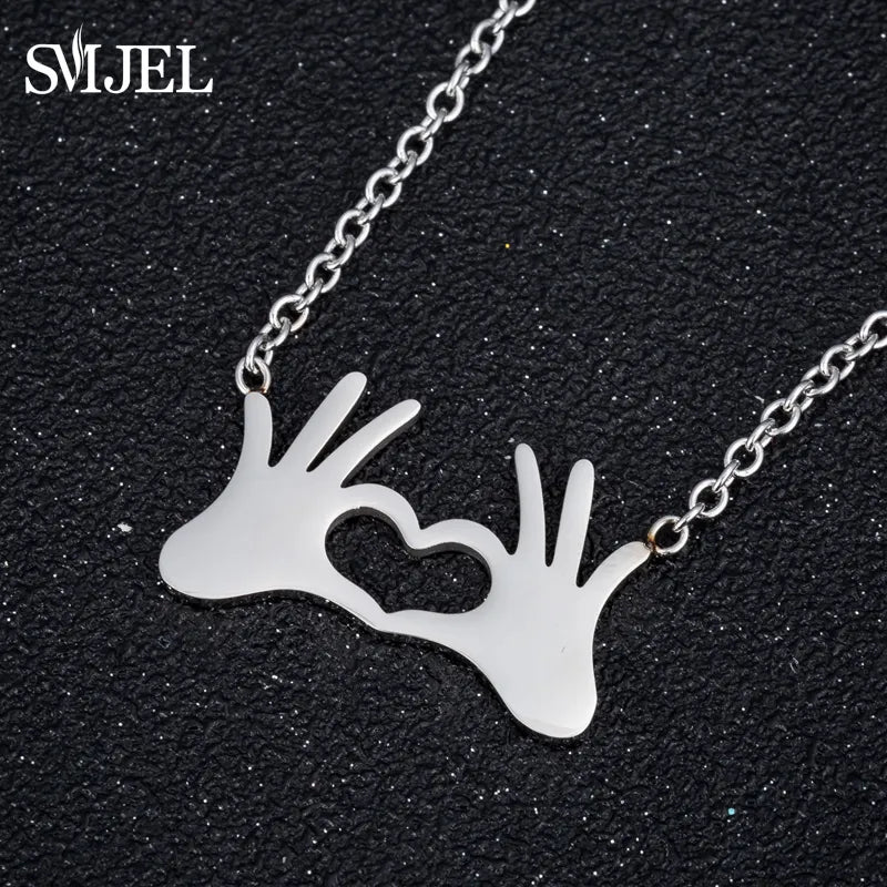 SMJEL Stainless Steel Charm Necklace Fashion Jewelry Hand Love Heart Gesture Necklace Pendant for Women Gift Best friends bijoux